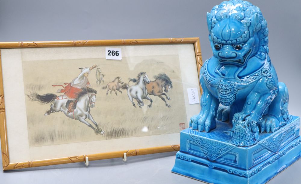 A turquoise glazed dog of fo, height 37cm and a silkwork